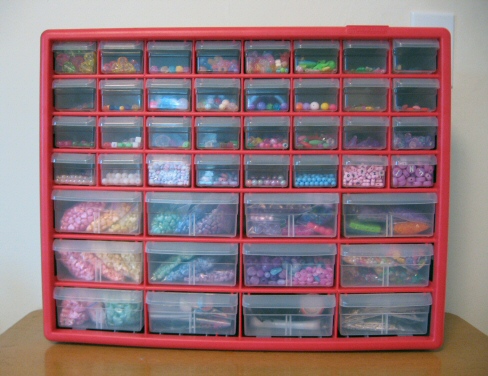 Plastic drawers full of colorful beads