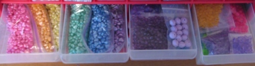 Small resealable bags of beads, sorted into bins