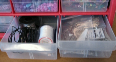 Jewelry components sorted into drawers