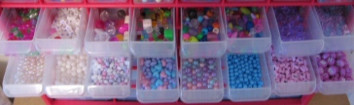 Organized drawers of plastic beads